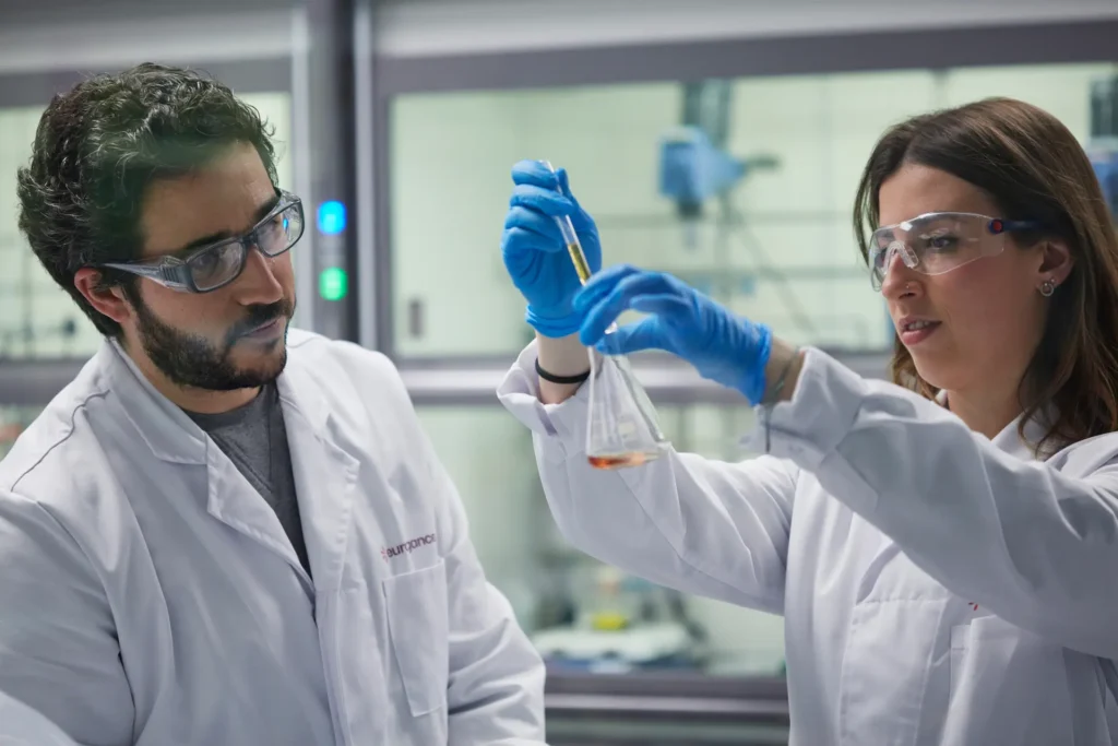 Scientists conducting an experiment in lab. They're professionals in Eurofragance