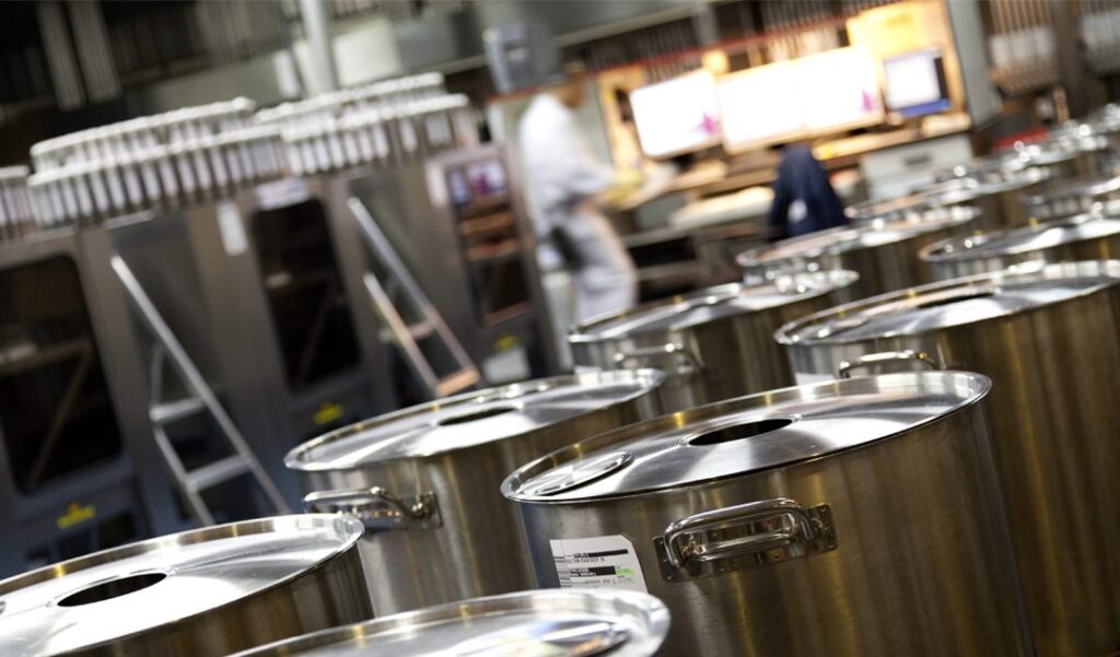 Metal barrels in industrial setting in Eurofragance facilities.