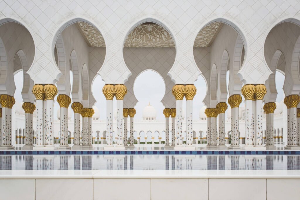 Ornate arches and reflective water surface from an Asian country