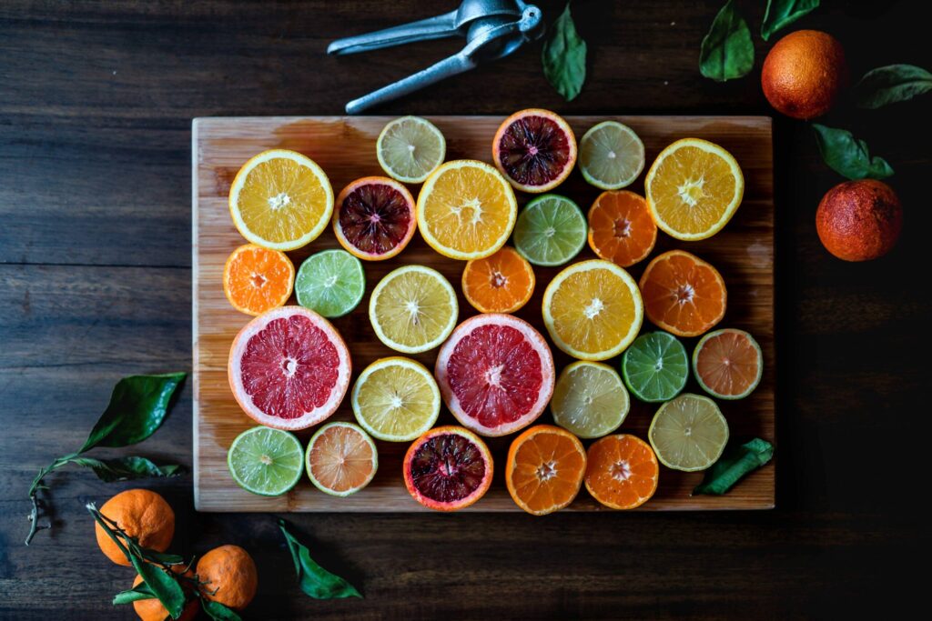 Colourful assortment of sliced citrus fruits.