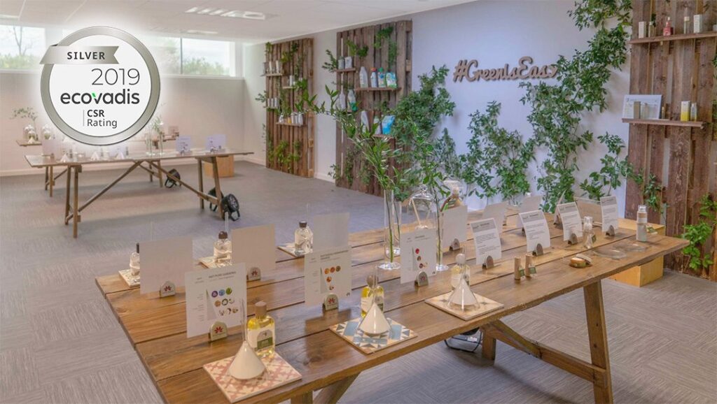 Modern workspace with eco-friendly displays for Ecovadis 2019 awards.