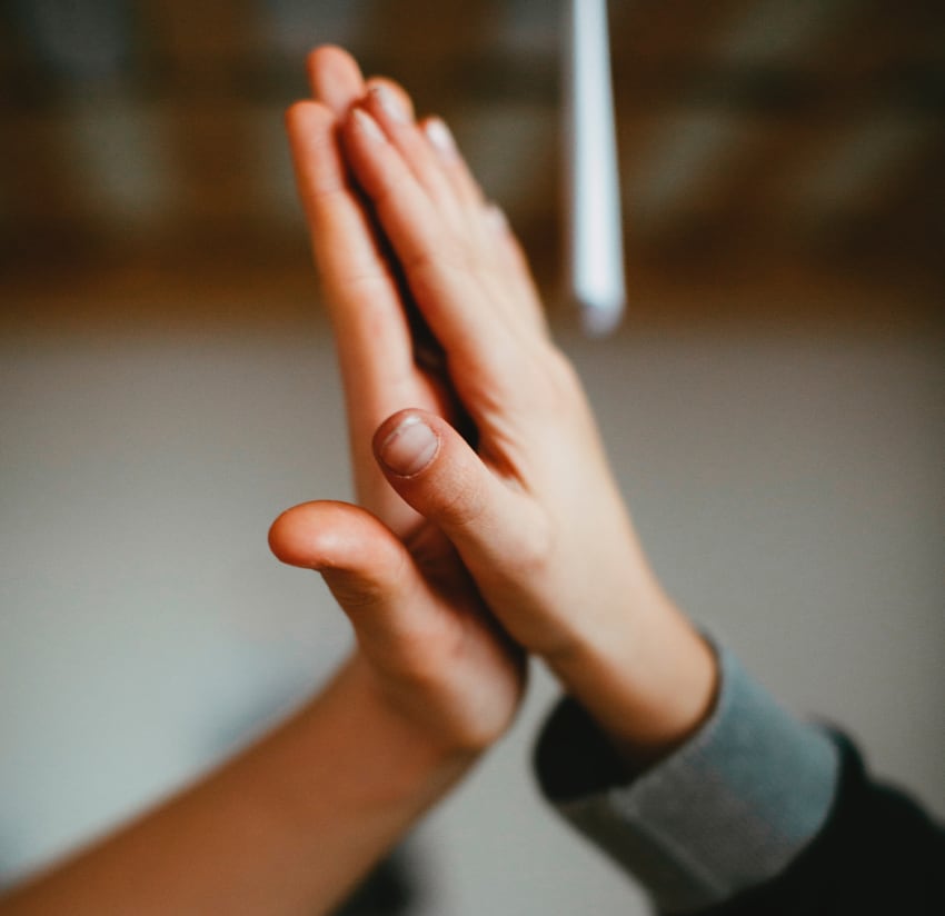 Two hands touching in greeting