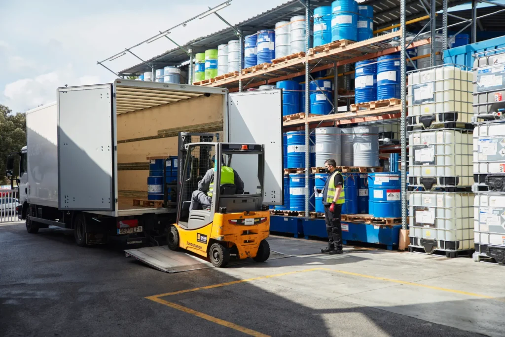 Forklift unloading truck at chemical warehouse from Eurofragance.