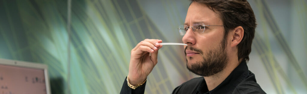 Olaf Larsen, master perfumer, smelling a scent test