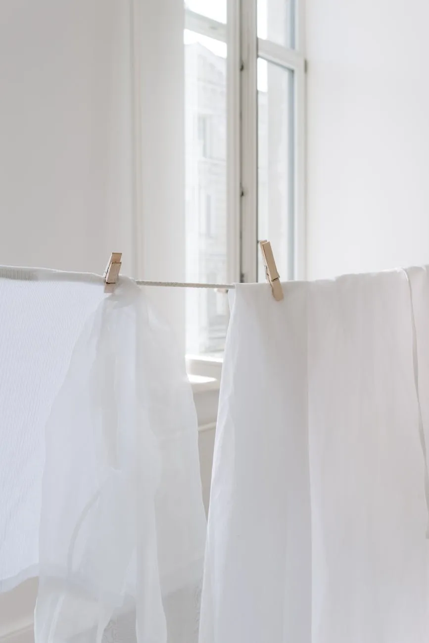 White fabric hanging by window