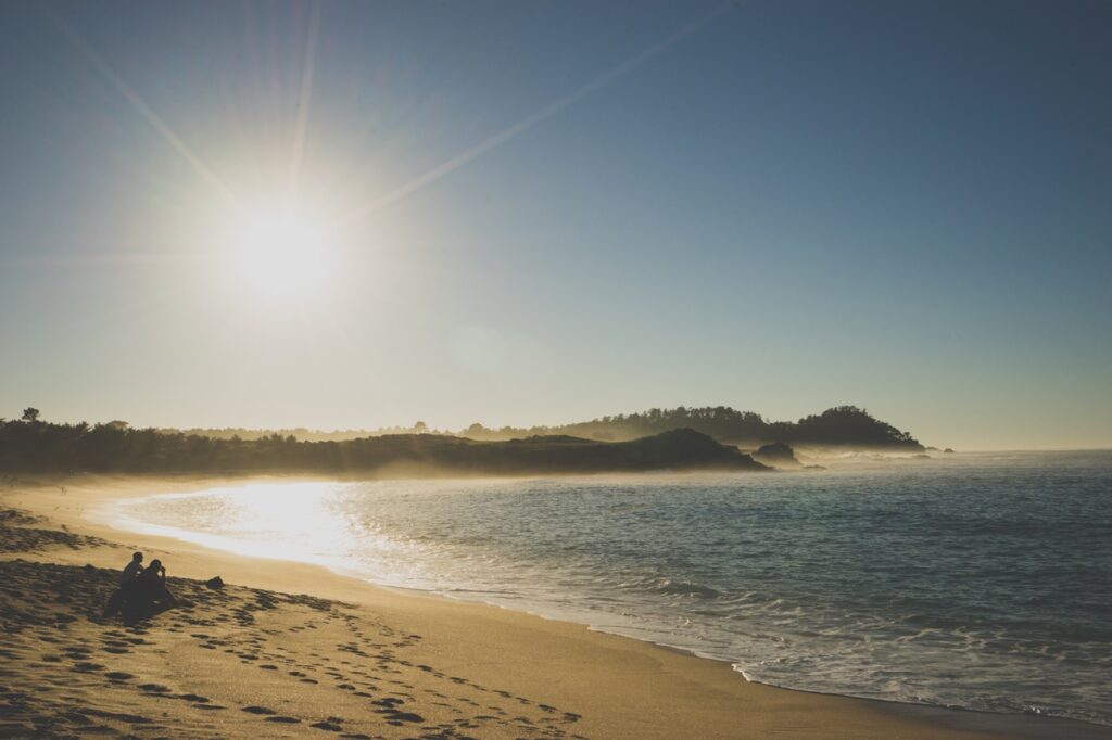 Serene beach at sunrise, peaceful atmosphere.